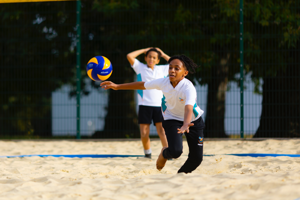 Teddington School - Student Diving for a Volleyball